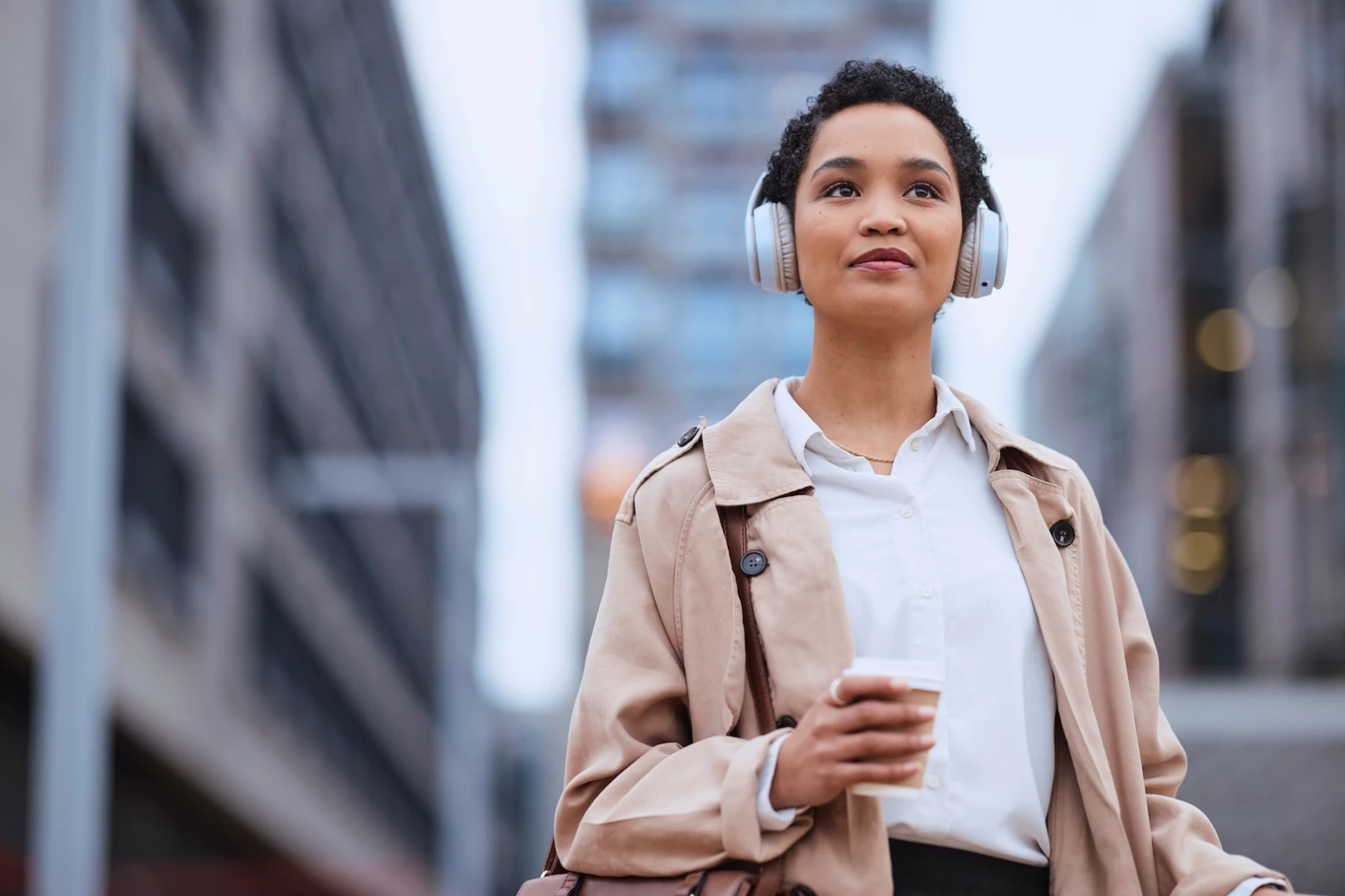 A woman listening to the IMS Insights Podcast about visual advocacy