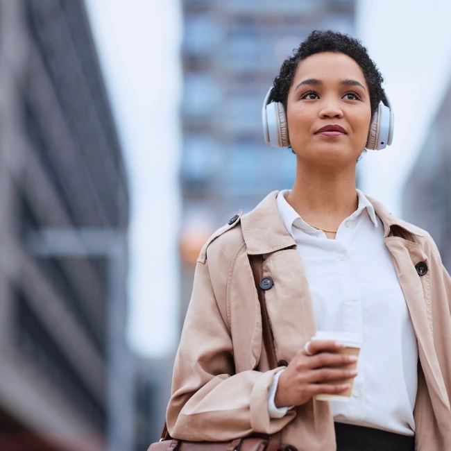 A woman listening to the IMS Insights Podcast about visual advocacy