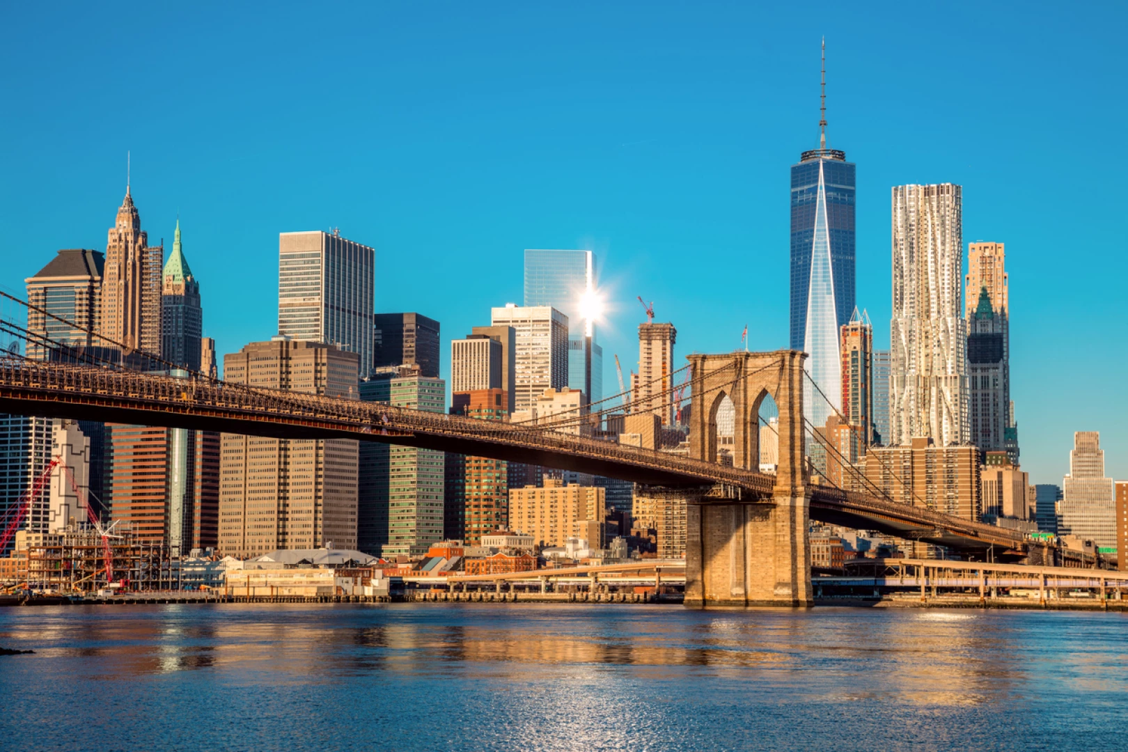 The New York City skyline featuring the iconic Brooklyn Bridge and Manhattan skyline