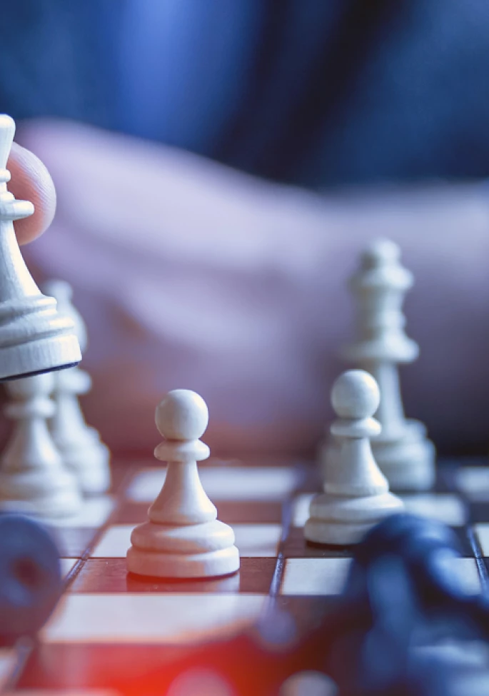 close up of chess game, hand moving pieces