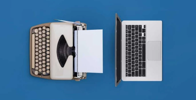Laptop Alongside a Printout Machine in a Workspace