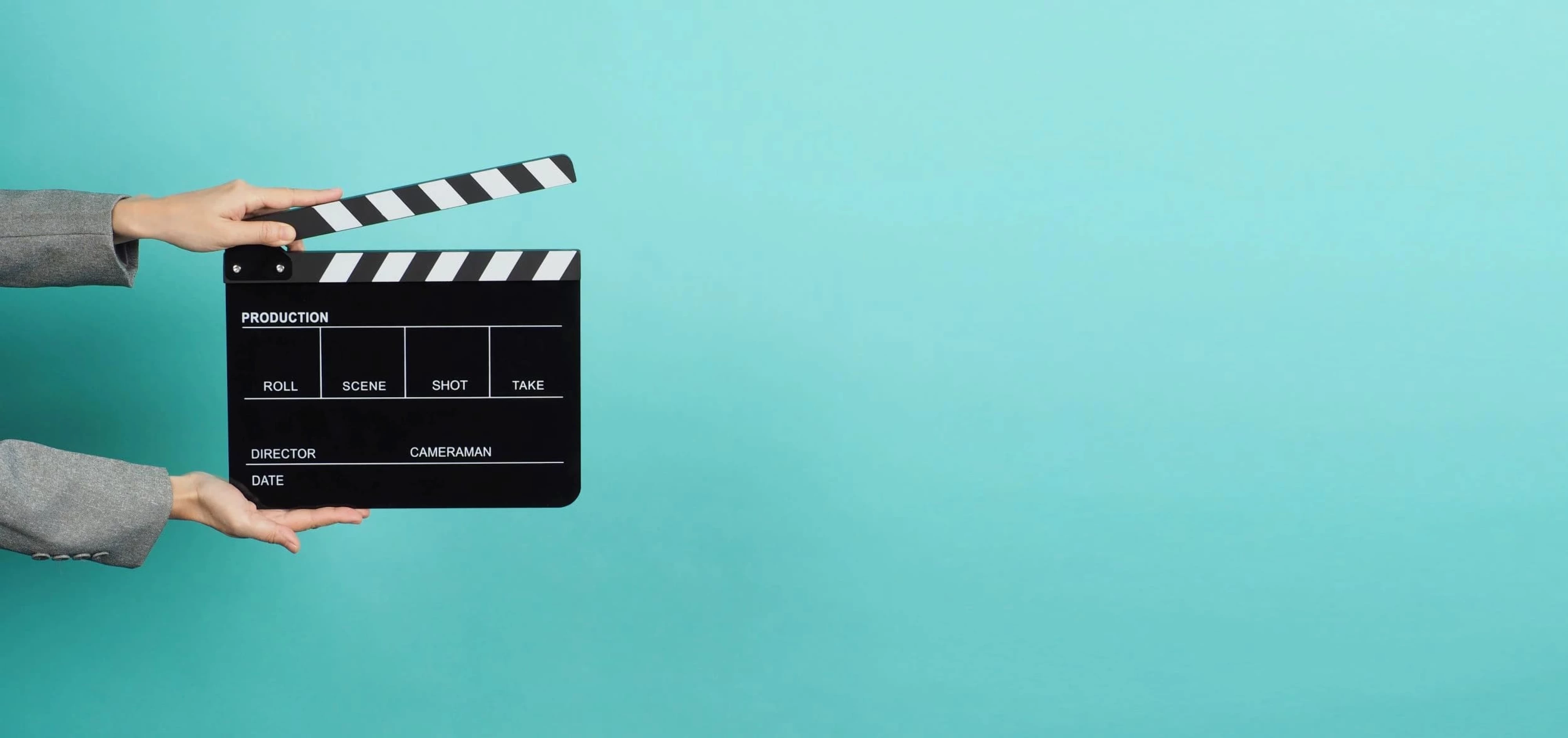 woman holding a clapperboard