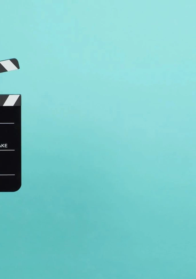 woman holding a clapperboard