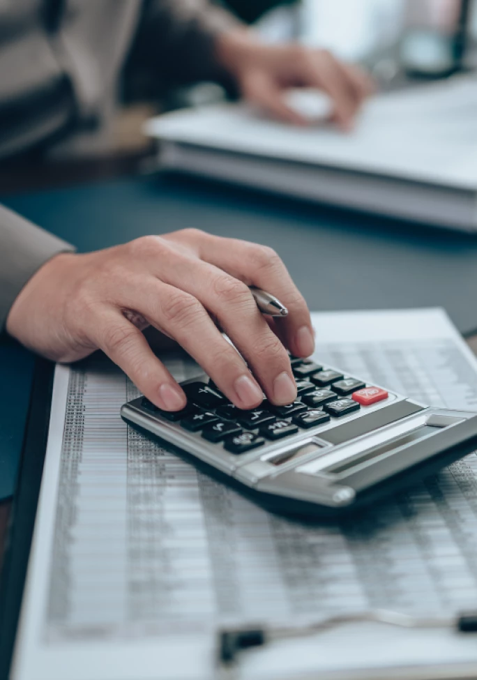 A man working using a calculator