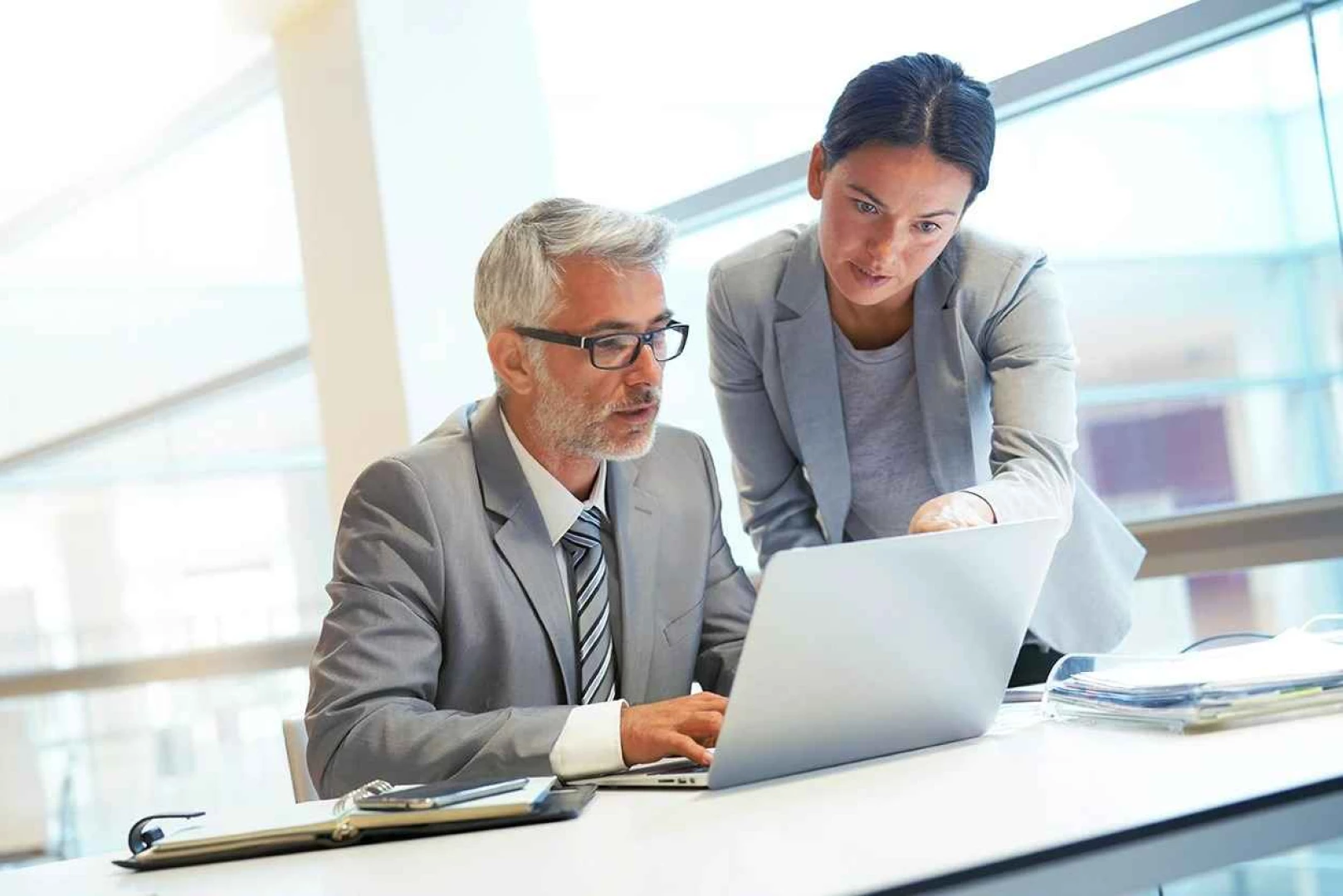 A man and a woman discussing legal strategies