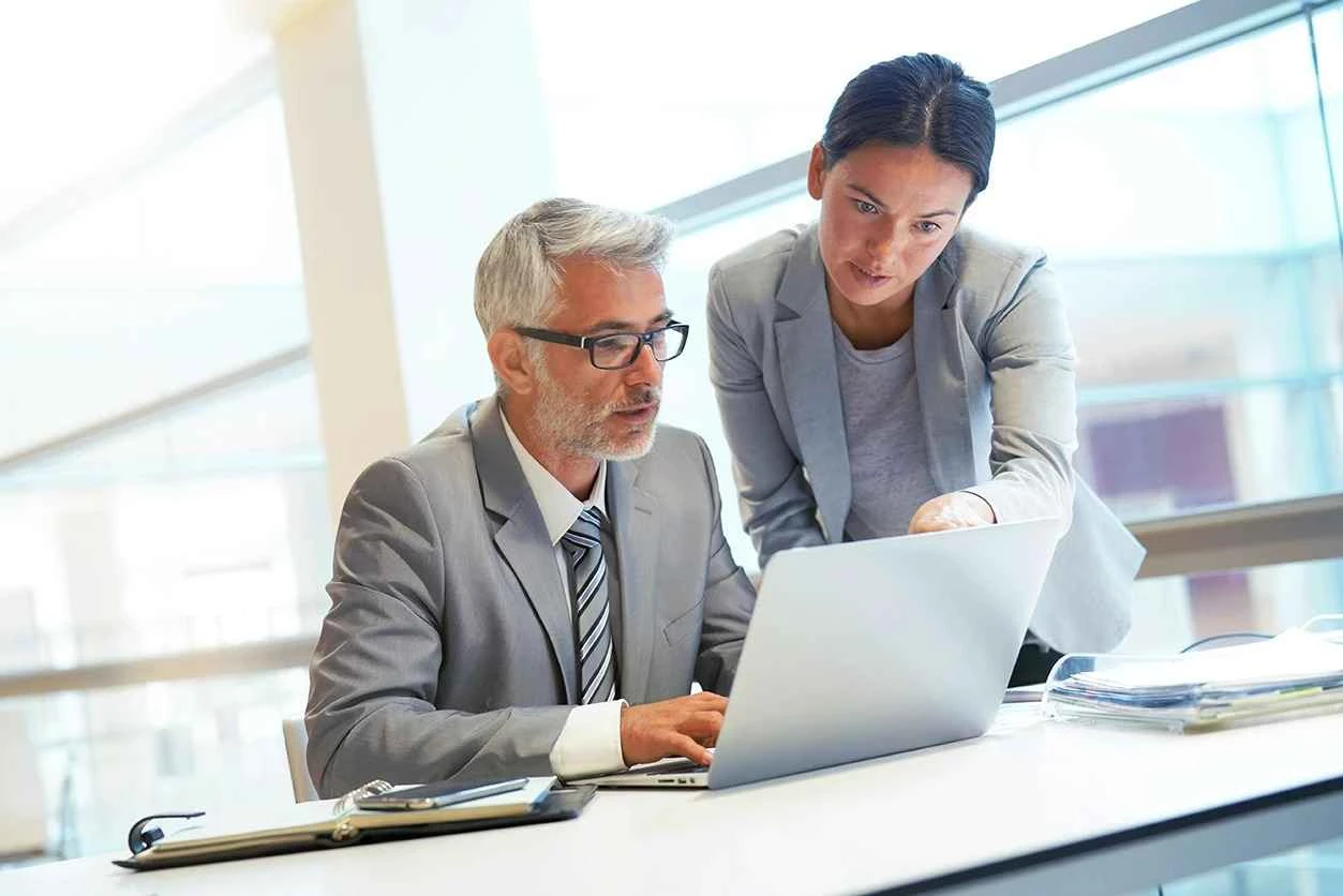 A man and a woman discussing legal strategies