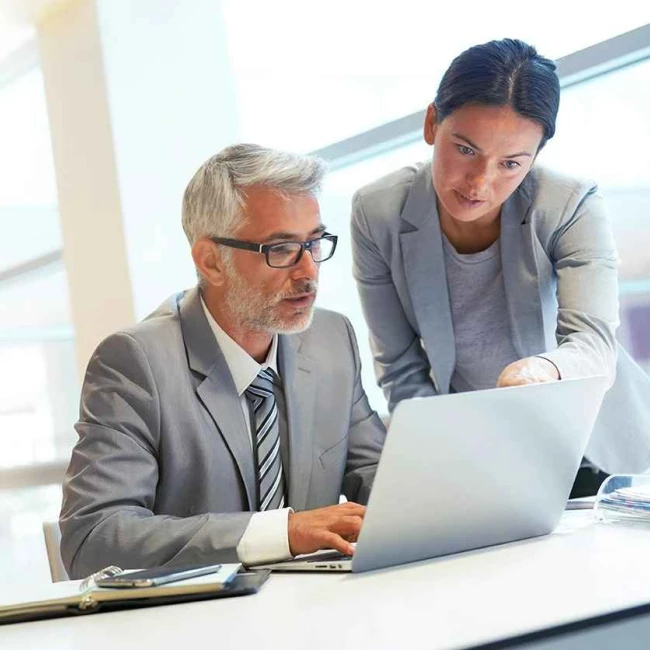 A man and a woman discussing legal strategies